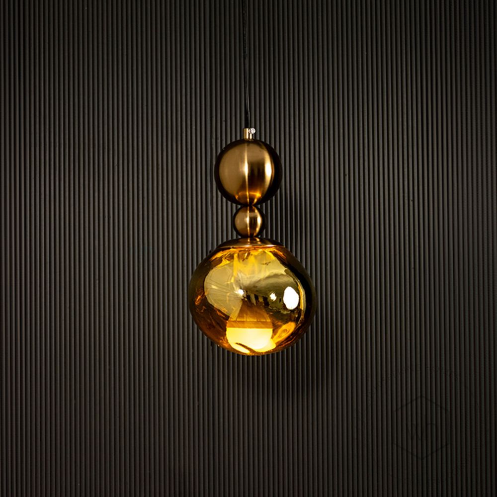 Umbra Pendant Light - Gold Light on black background