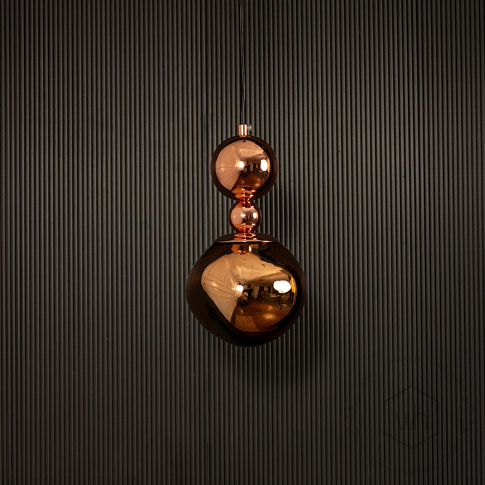 Umbra Pendant Light - Rose Gold Light off black background