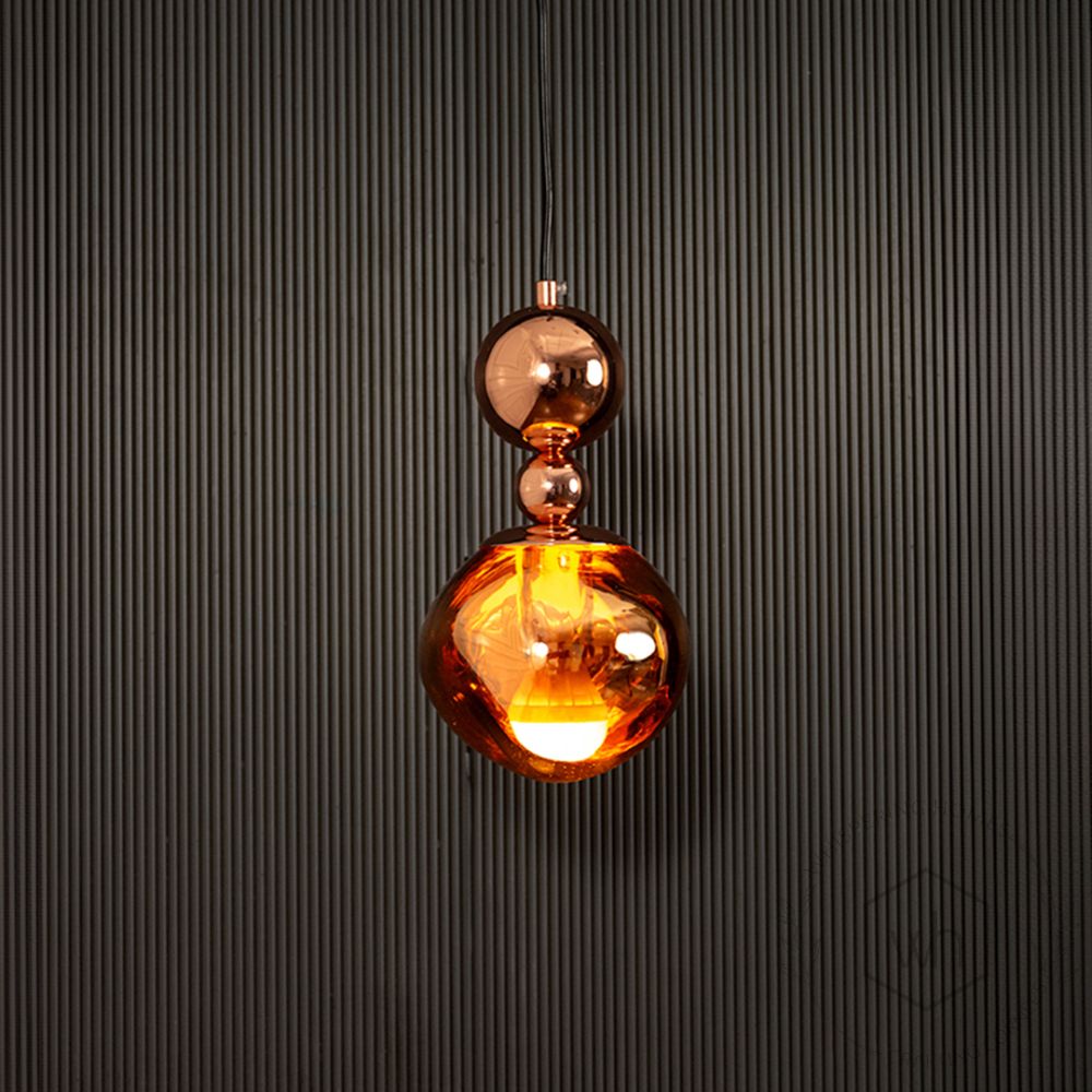 Umbra Pendant Light - Rose Gold Light on black background