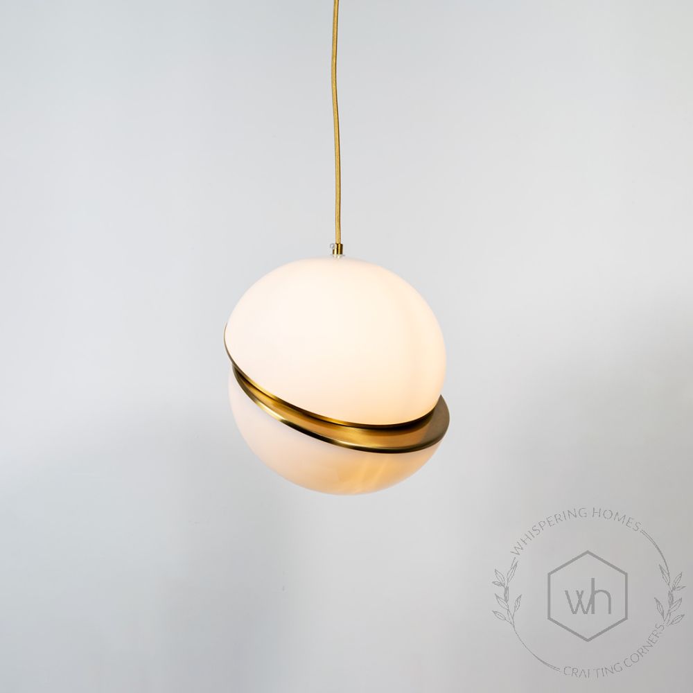 Gilded Ball Pendant Light Light On White Background