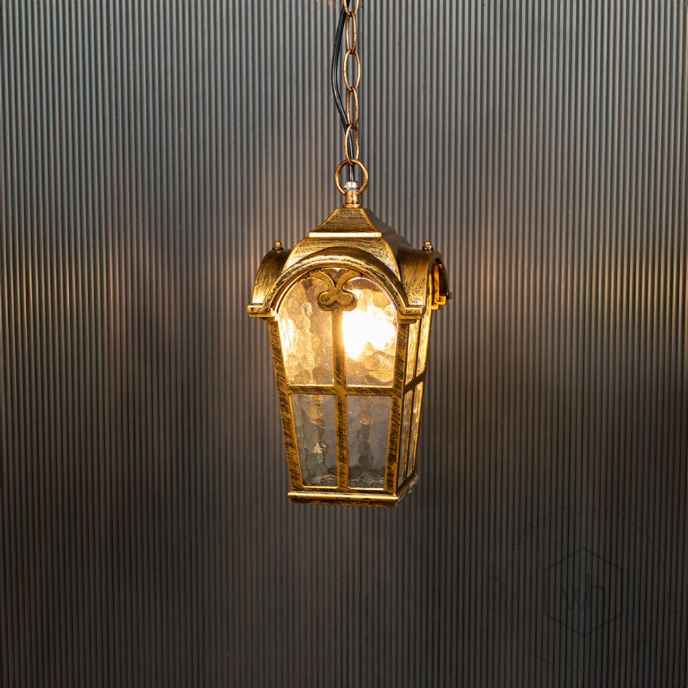 Industrial Outdoor Hanging Light - Gold Light On Black Background