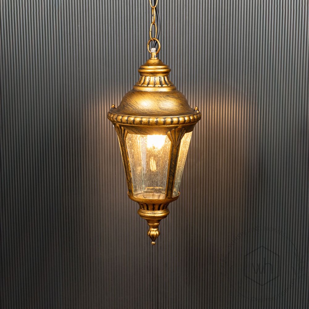 Traditional Outdoor Hanging Lamp - Gold Light On Black Background