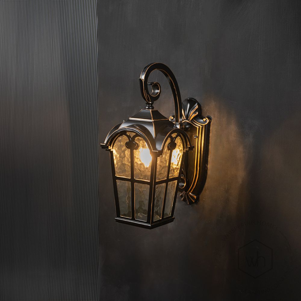 Benton Outdoor Wall Light - Gold Light On Black Background