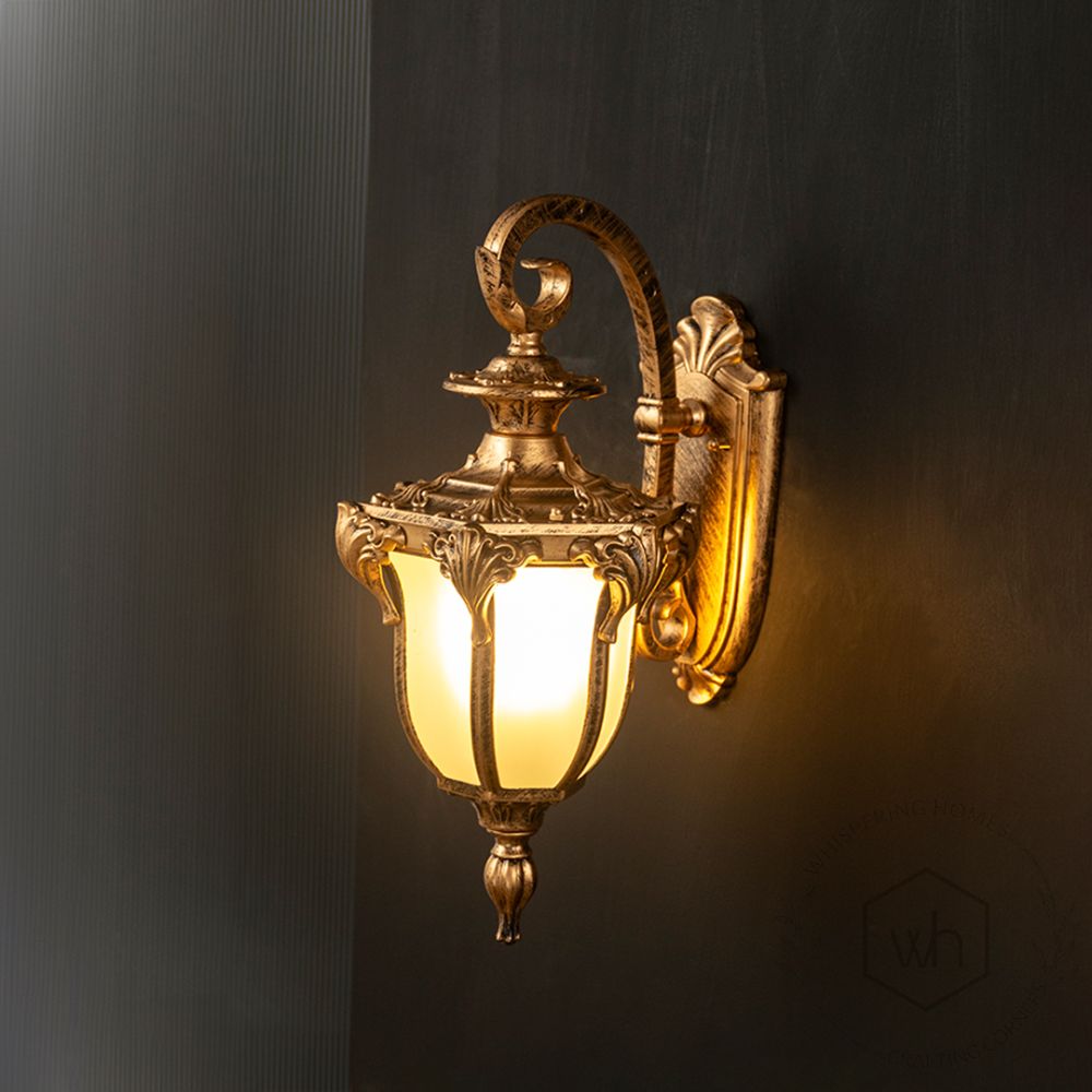 Calix Outdoor Wall Lamp - Gold Light On Black Background