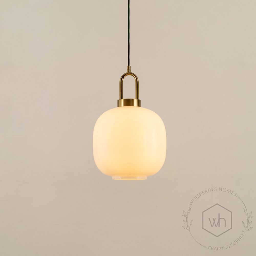 White Round Glass Shade Gold Metal Pendant Light Light On White Background