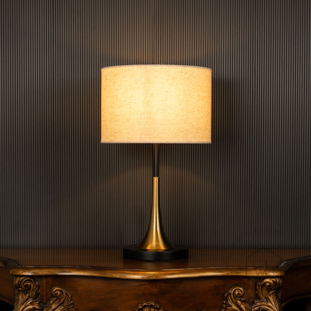 Lustroso Gold Black Metal Table Lamp with White Shade Light On Black Background