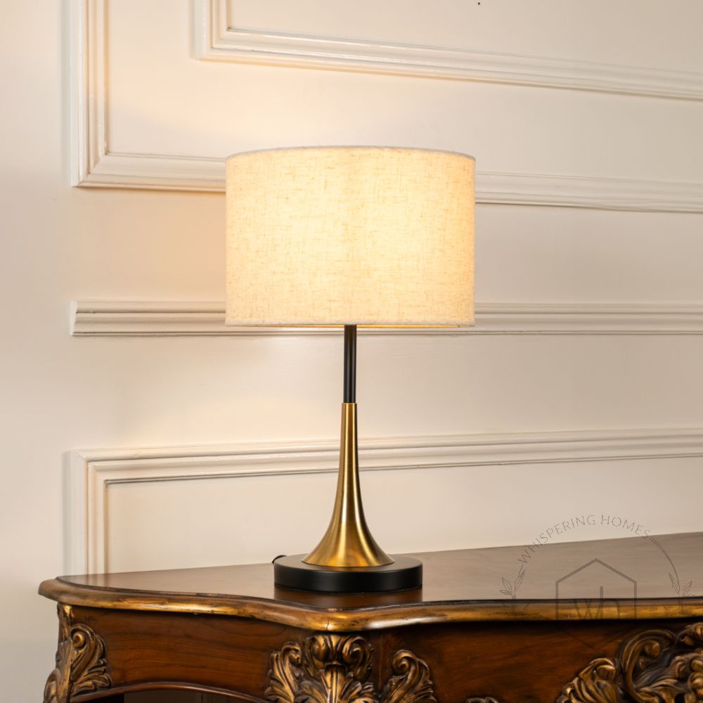 Lustroso Gold Black Metal Table Lamp with White Shade Light On White Background