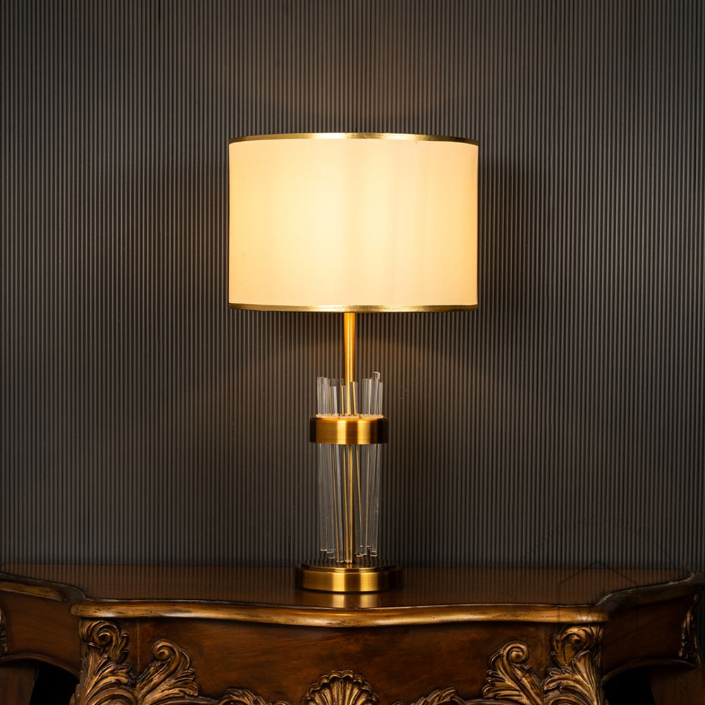 Skylo Gold Metallic Table Lamp with White Shade Light On Black Background