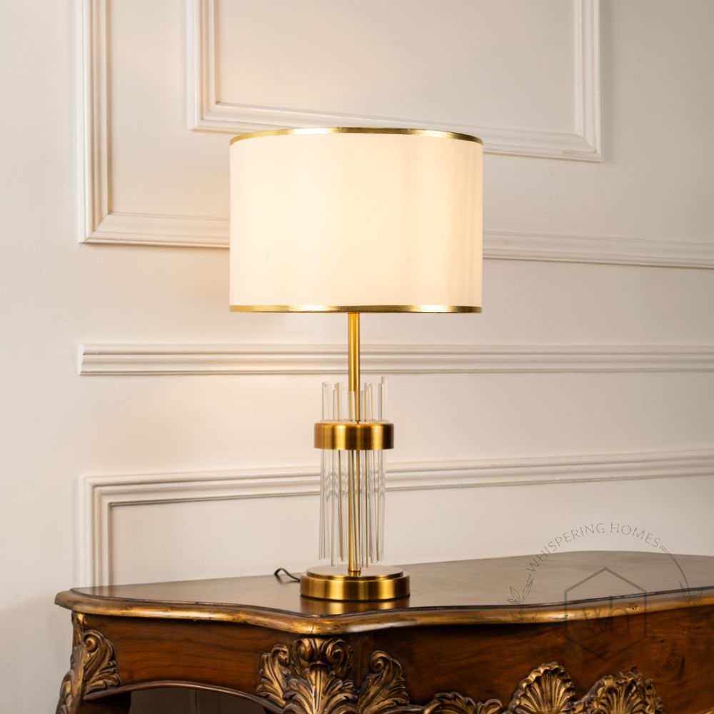 Skylo Gold Metallic Table Lamp with White Shade Light On White Background