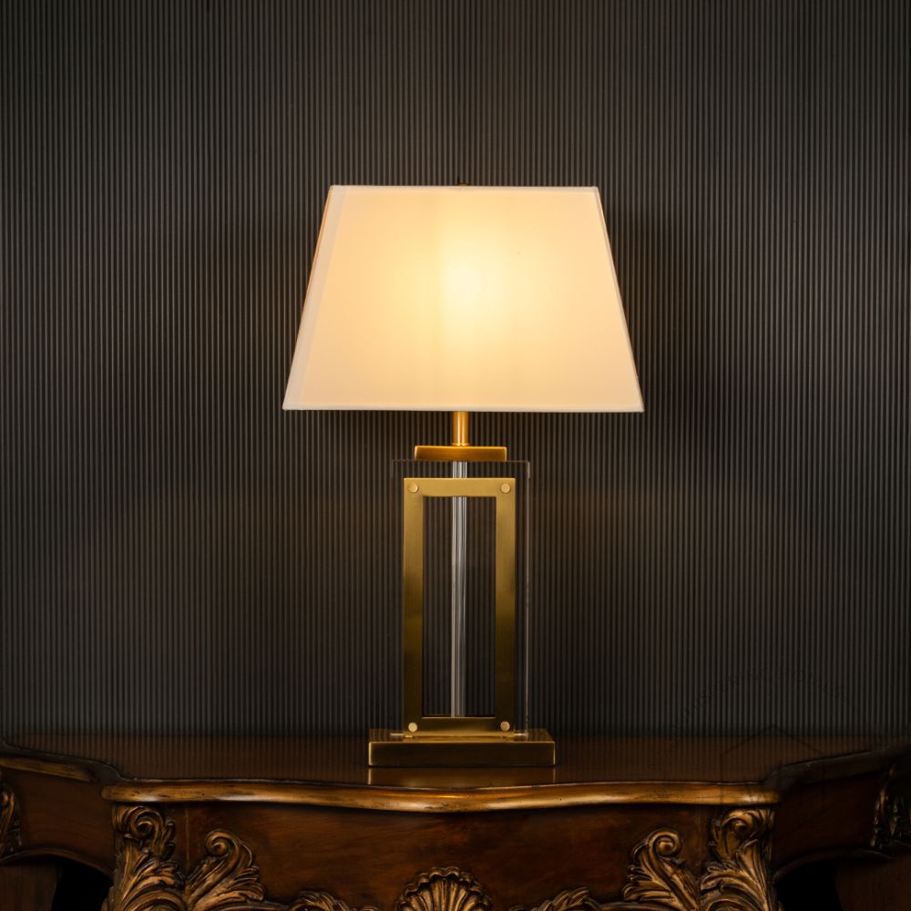 Regeco Gold Metallic Table Lamp with White Shade Light On Black Background