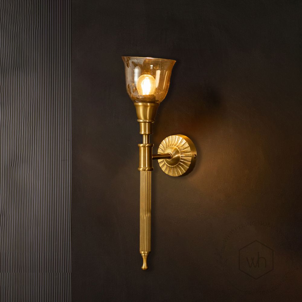 Elysian Brass Wall Sconce Glass Shade light on black background