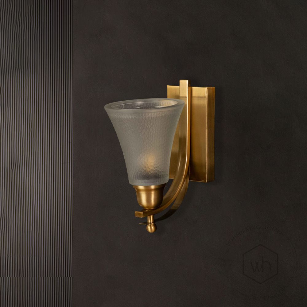 Crown Jewel Brass Sconce light off black background