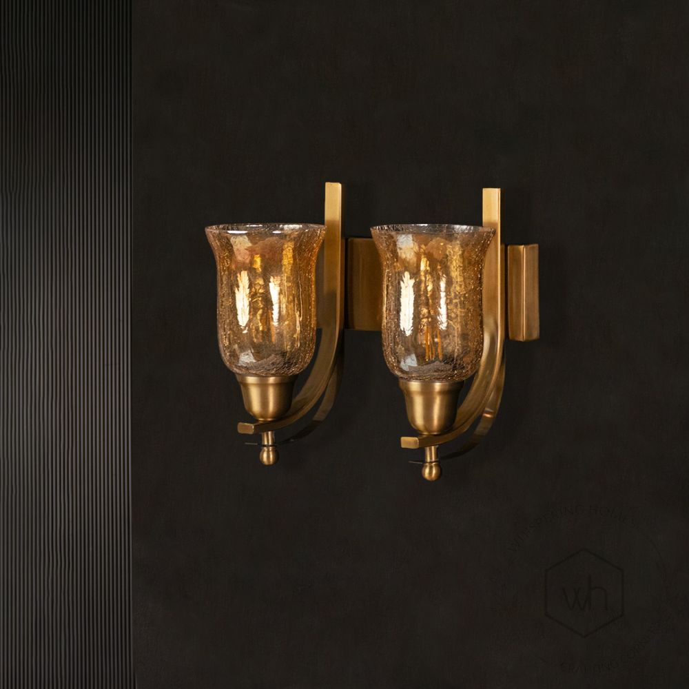 Crown Jewel Brass Double Sconce light off black background