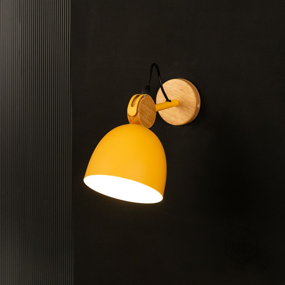 Macaron Loft Adjustable Wall Light Yellow Light On Black Background