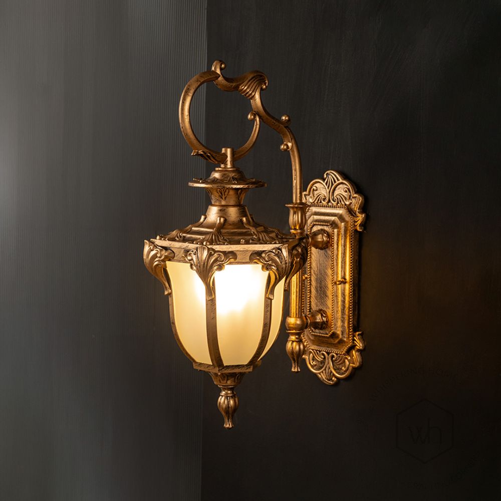 Fervor Outdoor Wall Light - Gold Light On Black Background