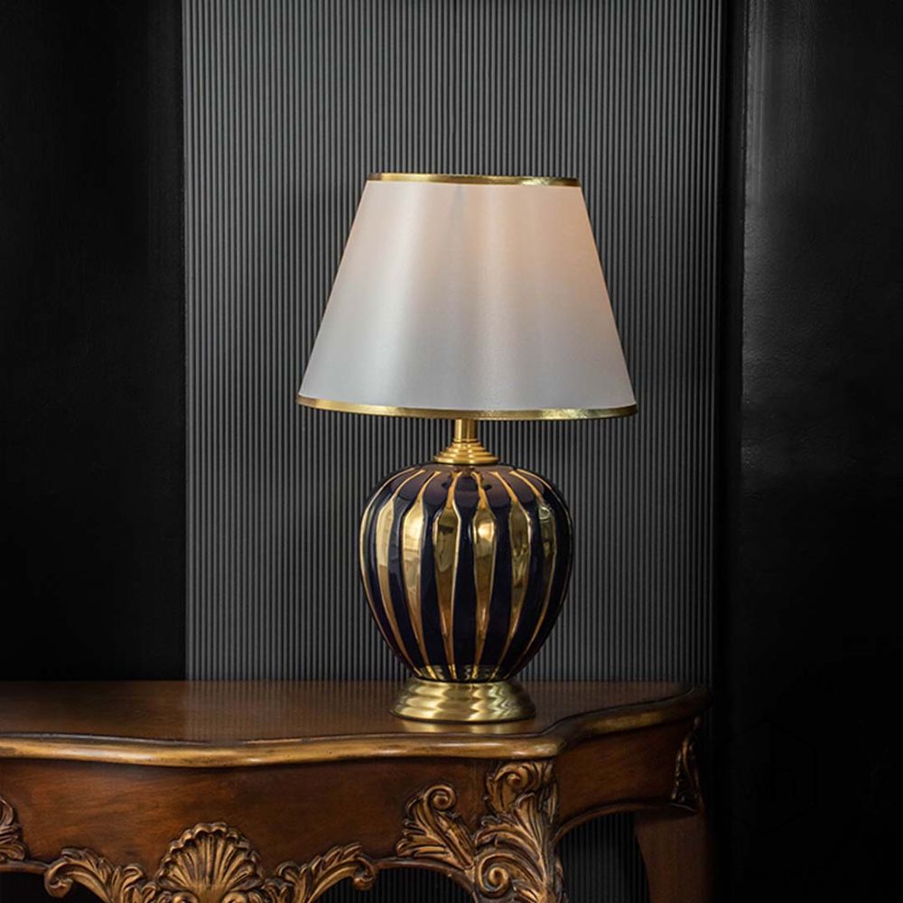 Cathenna Table Lamp - Gold & Dark Blue Light On Black Background