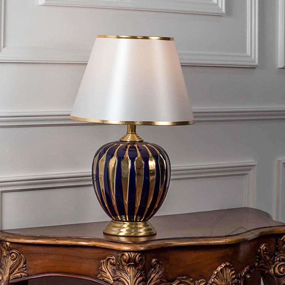 Cathenna Table Lamp - Gold & Dark Blue Light On White Background