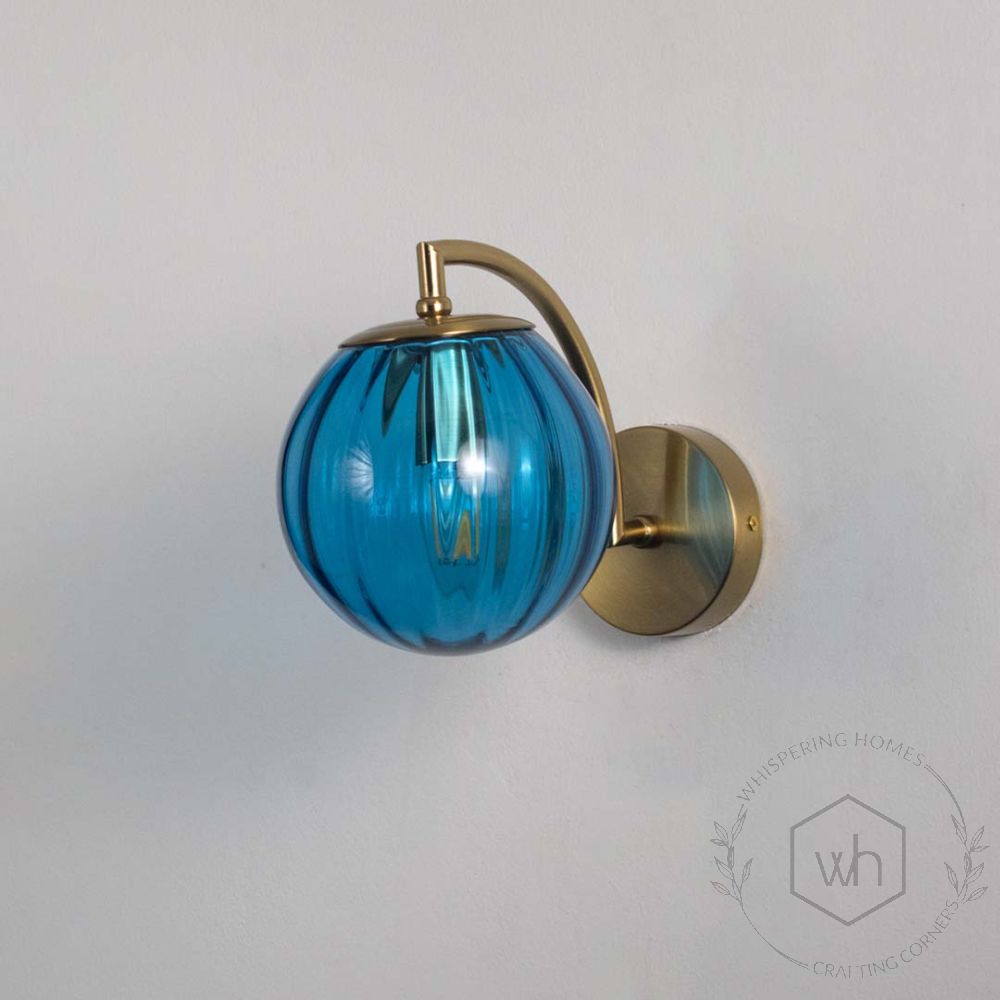 Modern Globe Brass & Blue Wall Light Light Off White Background