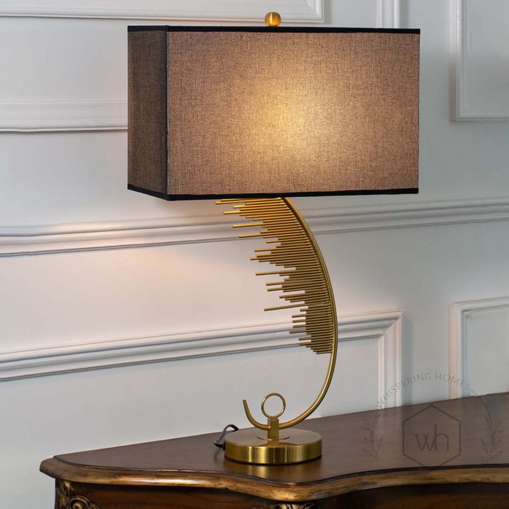 Pluma Golden Metal Table Lamp with Black Shade Light On White Background