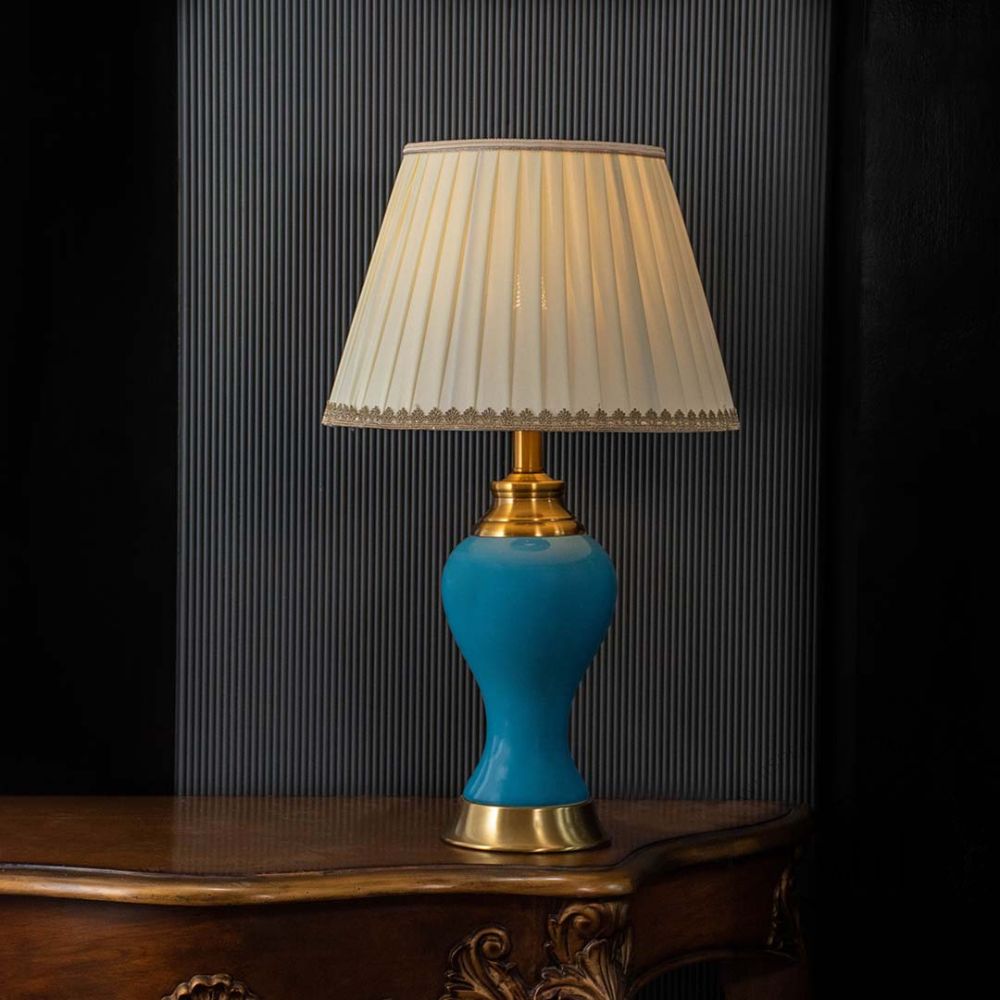 Maroq Table Lamp - Gold & Blue Light On Black Background