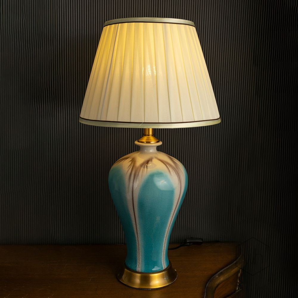 Modern Glazed Ceramic Table Lamp - Blue Light On Black Background