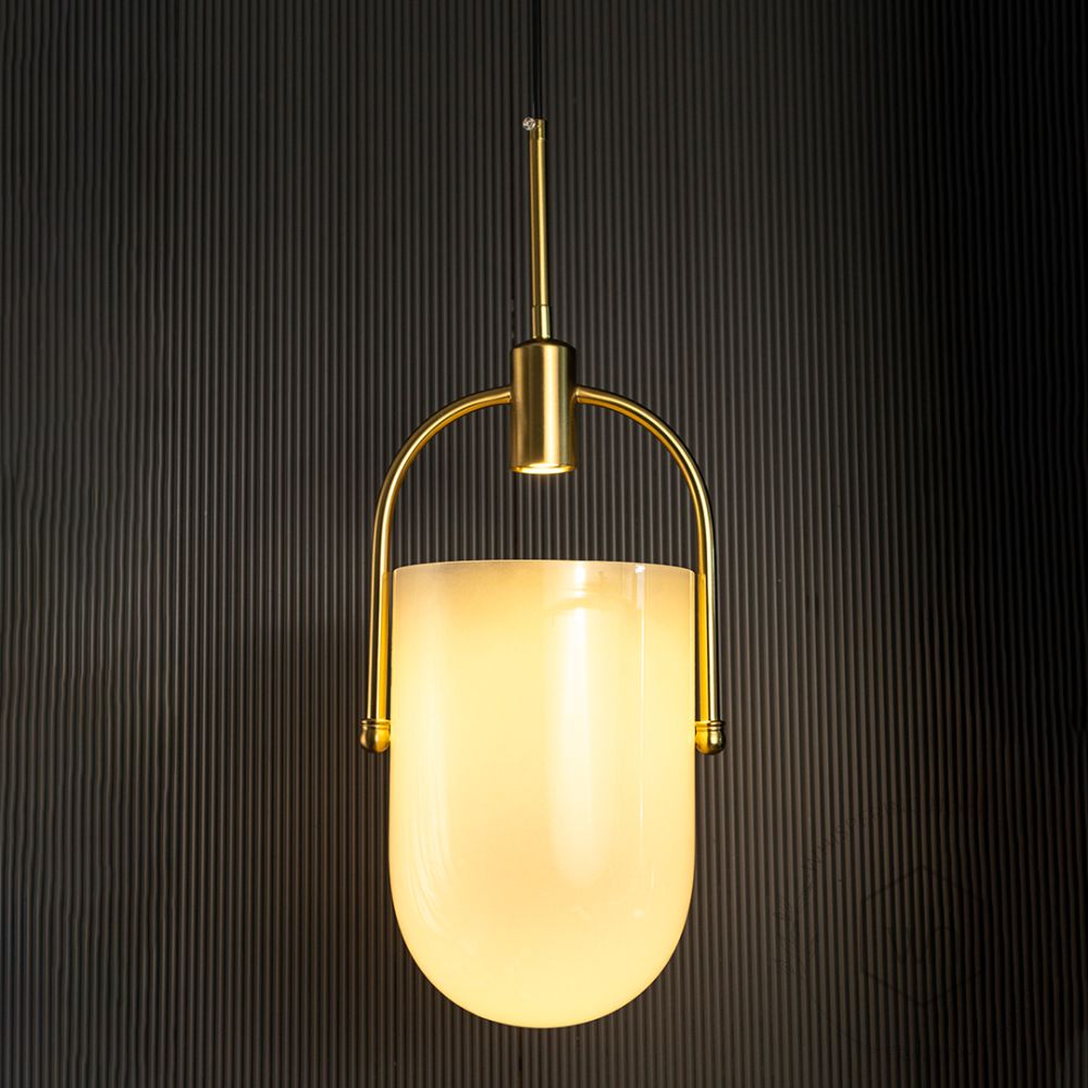 TURA Contemporary Brass & Milk White Glass Pendant Light Light On Black Background