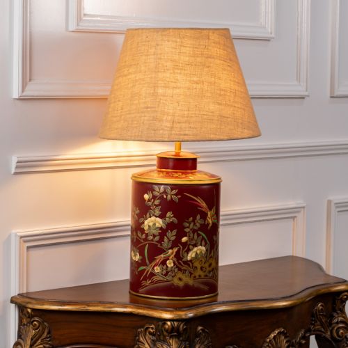 Gilded Phoenix Red Metal Table Lamp with Beige Linen Lamp shade Light On White Background