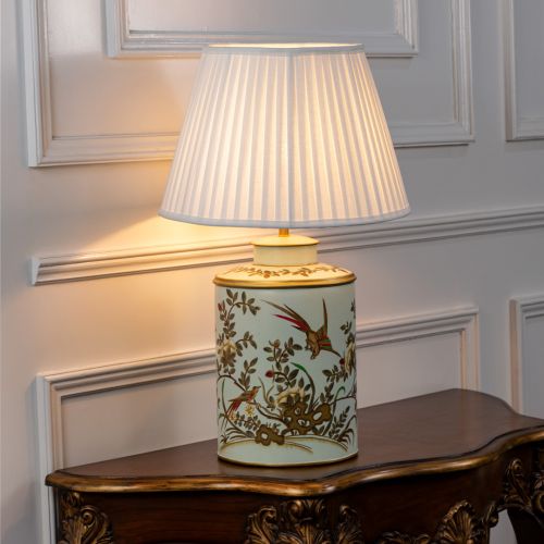 Gilded Phoenix Green Metal Table Lamp with White Pleated Lamp shade Light On White Background