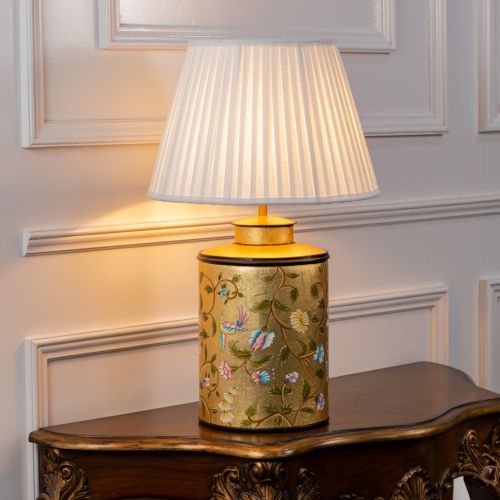 Oriental Orchard Gold Metal Table Lamp with White Pleated Lamp shade Light On White Background