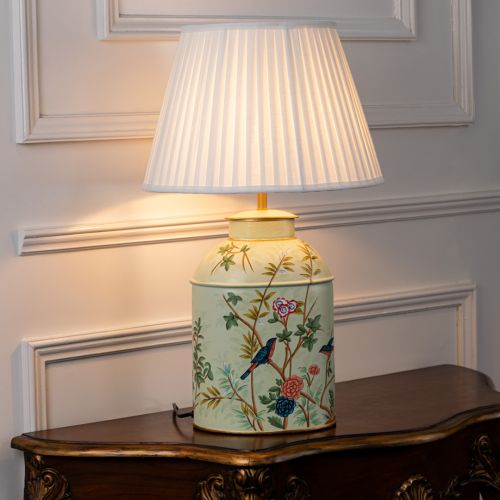 Tropical Garden Green Metal Table Lamp with White Pleated Lamp shade Light On White Background