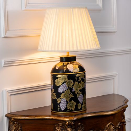 Grape Vine Black Metal Table Lamp with Off White Pleated Lamp shade Light On White Background